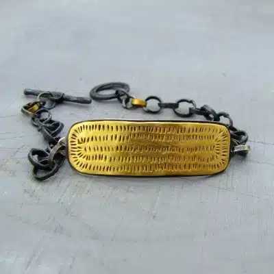 22k gold bar and silver bracelet