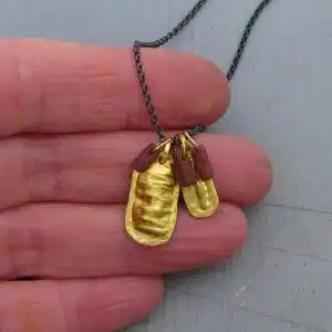 Raw Ruby 22k gold pendant