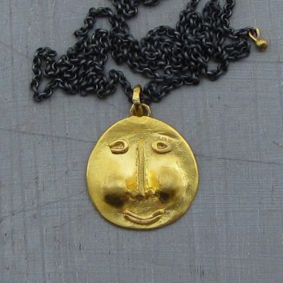 Face 22k gold & silver necklace