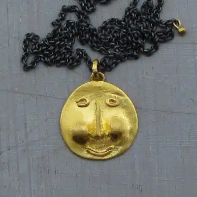 Face 22k gold & silver necklace