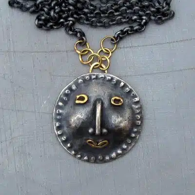 Handmade artisan face silver & 14k gold necklace