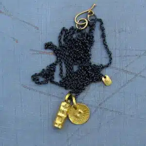Dangling 22k gold pendants with silver chain