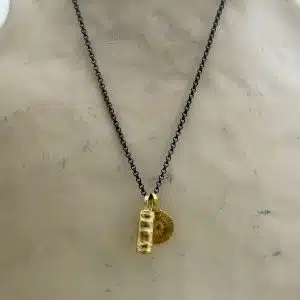 Dangling 22k gold pendants with silver chain