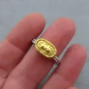 Elliptic 24k gold ring with silver band