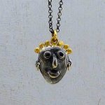 Face gold and silver necklace