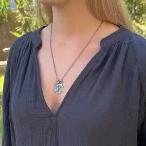 22 karat gold and silver primitive face necklace