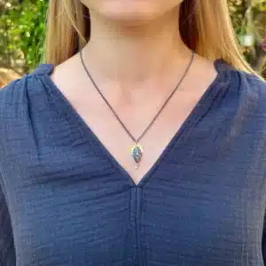 22 karat gold and silver crown face necklace