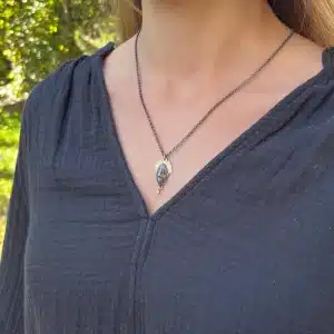 22 karat gold and silver crown face necklace