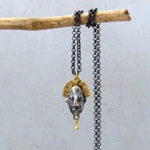 22 karat gold and silver crown face necklace