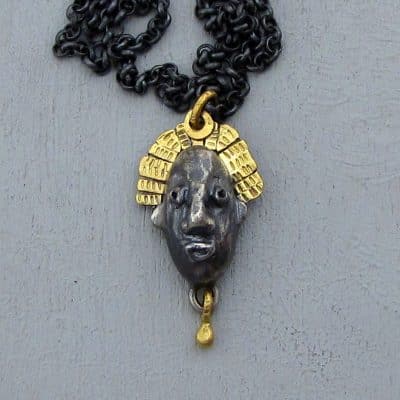 22 karat gold and silver crown face necklace